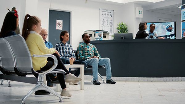 Diverse group of people waiting for medical appointment